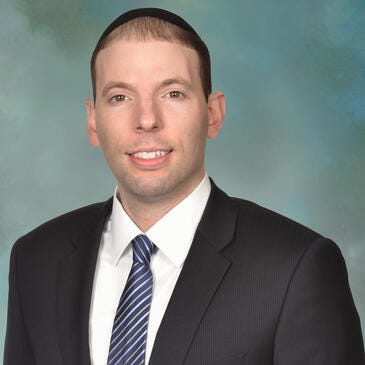 a man in a suit and tie