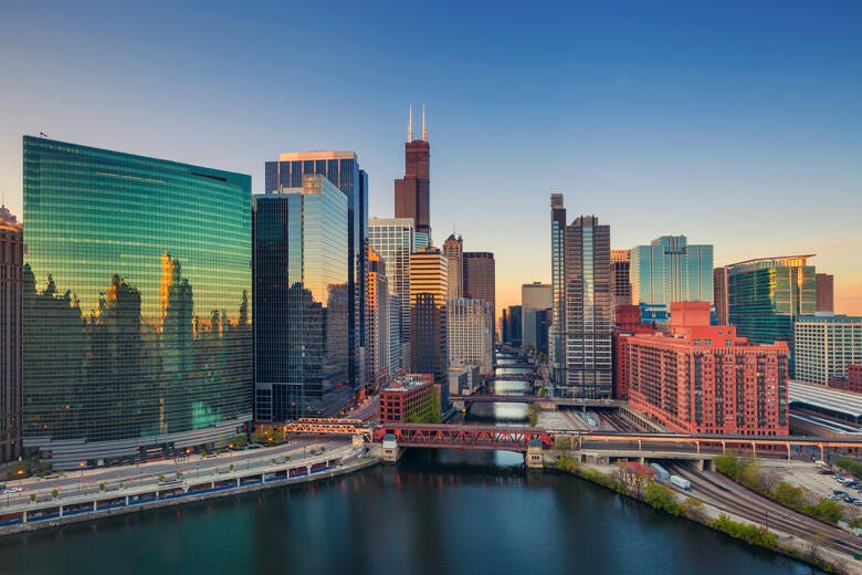 a city skyline with a river