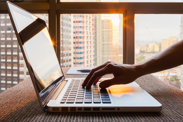 hand on a laptop