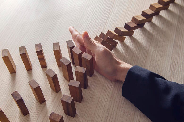 a hand on a wooden board