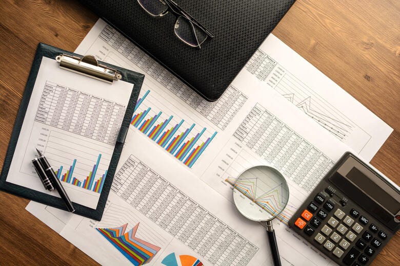 a calculator and a pen on a table