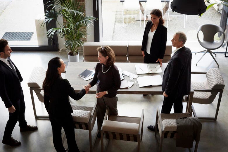 a group of people around a table