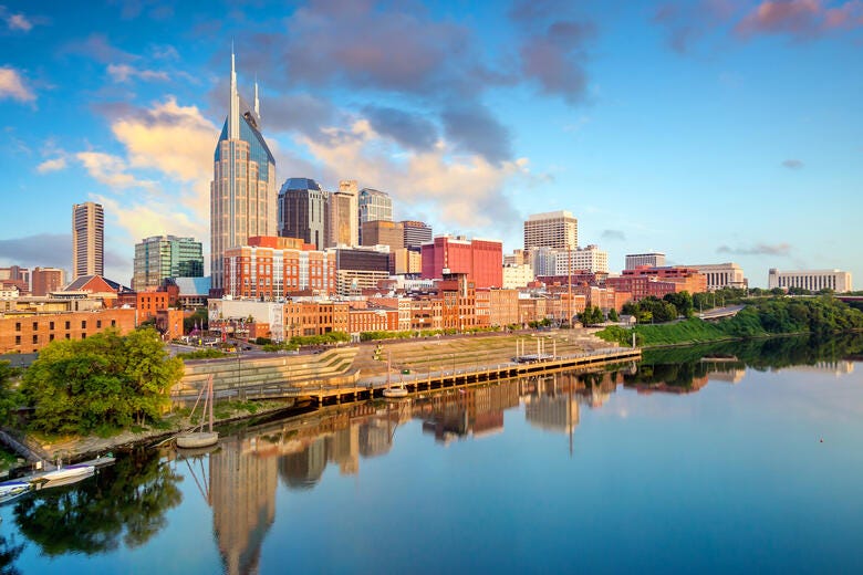 a city skyline with a river