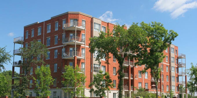 a building with trees in front of it