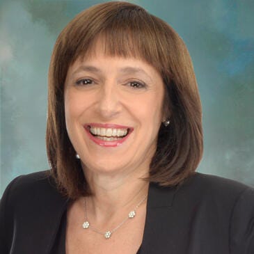 a woman smiling for the camera