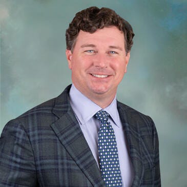 a man in a suit and tie