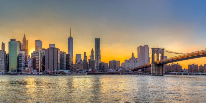 a city skyline with a bridge
