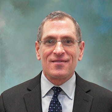 a man wearing a suit and tie