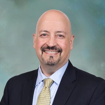 a man in a suit and tie
